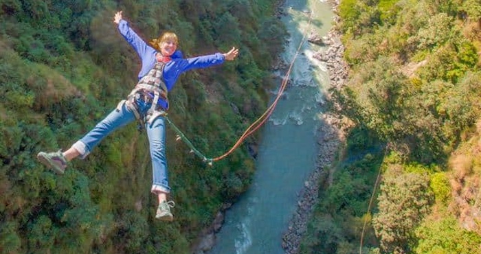 Lady on canyon swing 200 metres high