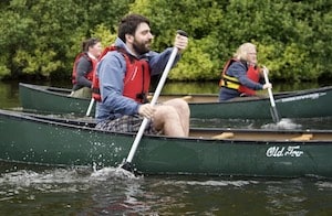 Two people canoeing in a charity challenge event